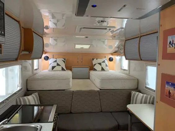 Bed area of a truck camper interior for two people